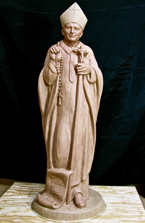 JPII CLAY - Four Crowns Statuary of Hastings and Lincoln has worked with Nebraska artist Sondra Jonson to create a new, affordable concrete statue of St. John Paul II. Jonson’s clay sculpture that the mold was made from is pictured. The statue will be available for sale in November and can be made in a variety of color schemes. (Courtesy photo)